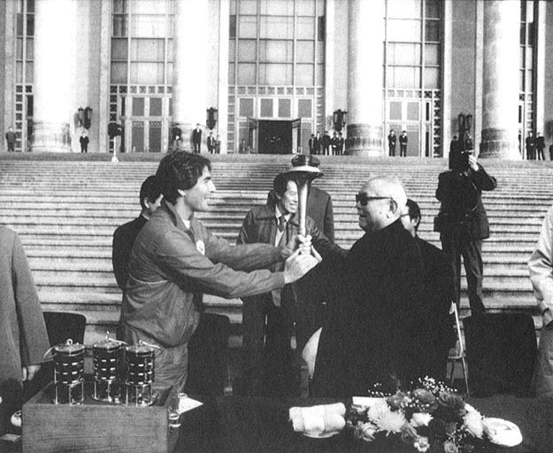 First Earth Run President David Gershon, giving peace torch to Li Xiuannian, President of China, at Great Hall of People. Bejing, China