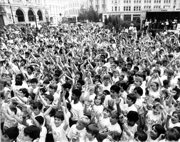 Children cheering the arrival of the torch. Birmingham, England