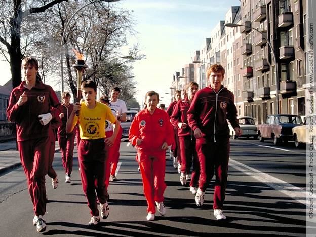 Torch bearer and runners. East Berlin, Germany
