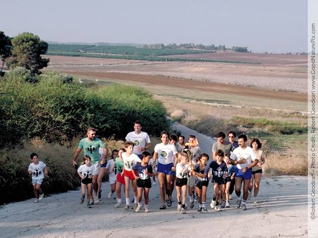 Arab and Jewish children from the Neva Shalom community carry the torch of peace together on the way to Jerusalem. Israel