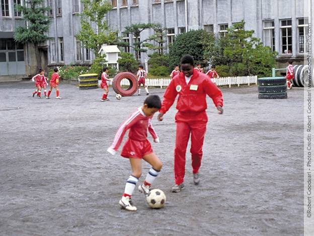 Pre event soccer with global runner Selina Chirchir and young boy. Nagasaki, Japan