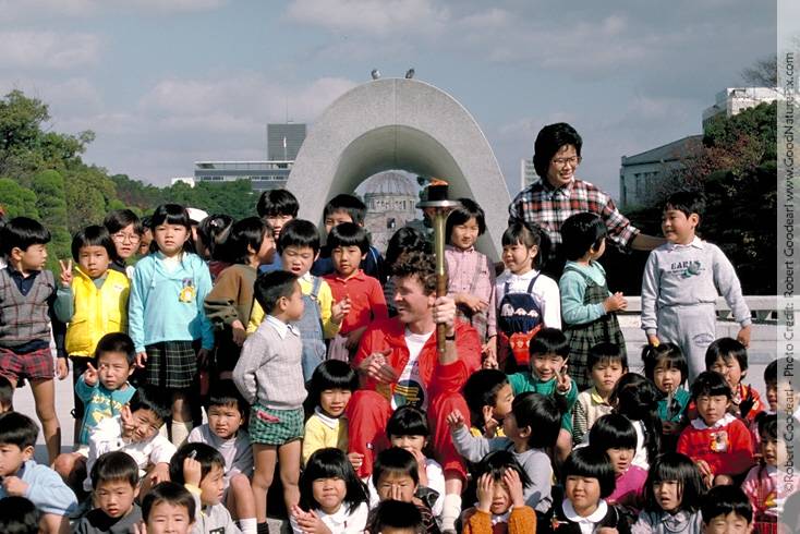 Children talking with global runner from United States, Phil Wiengarner. Hiroshima, Japan