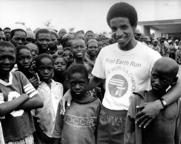 Runner with children. Nairobi, Kenya