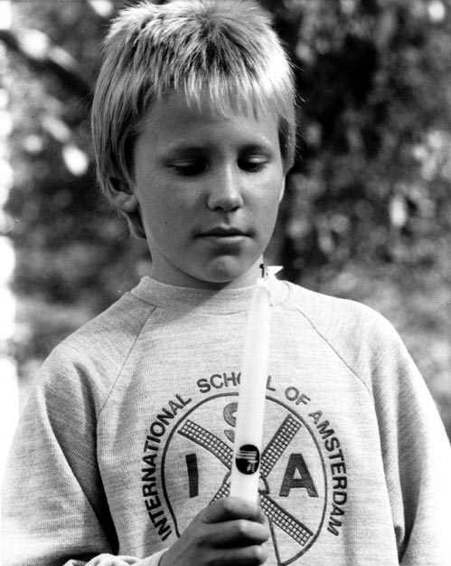 Boy with peace candle. Amsterdam, Netherlands