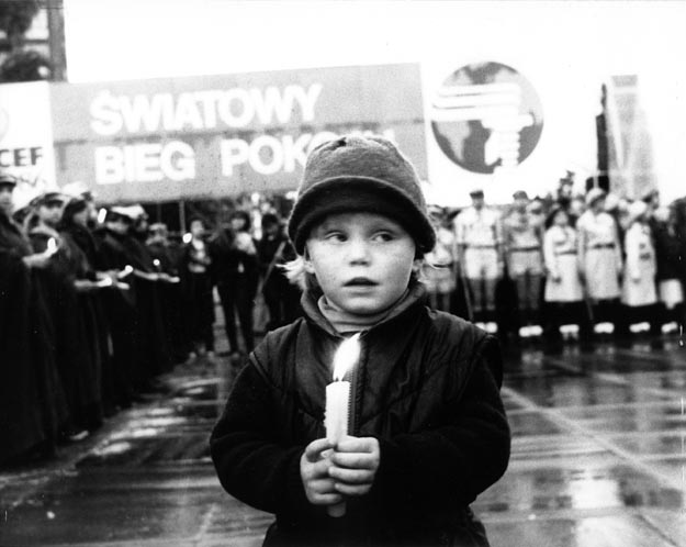 Young boy with peace candle. Warsaw, Poland