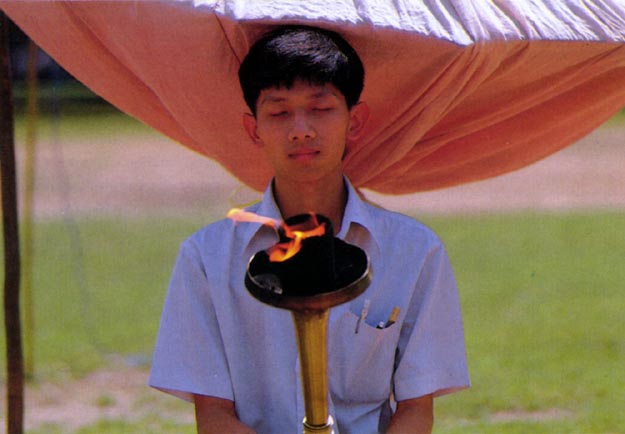 Peace meditation with torch at Thammasat University. Bangkok, Thailand