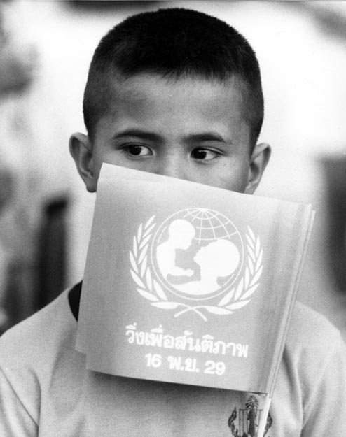 Boy with UNICEF flag. Chiang Mai, Thailand