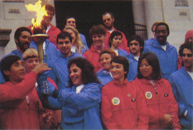 UN Athletic Club runners in blue, join global runners in red to merge peace flame with John F. Kennedy's eternel flame at Arlington National Cemetery. Washington, DC, USA